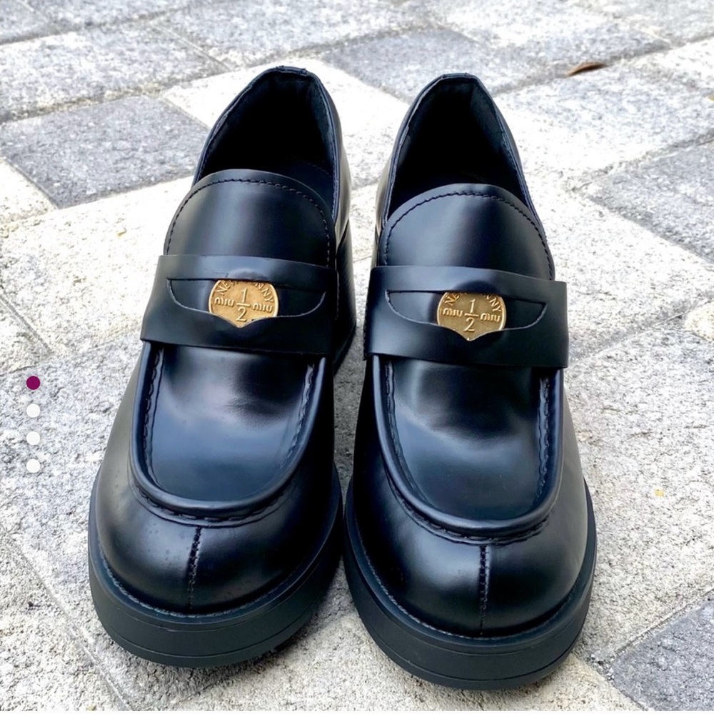 MIU MIU  Black Platform Penny Loafers.  New!!  Size 39